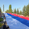 В парке Победы развернули триколор и почтили память защитников Отечества